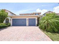 Beautiful home with a paved driveway and a convenient three-car garage at 10275 Henbury St, Orlando, FL 32832