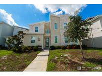 Charming two-story home boasting modern architectural design, manicured landscaping, and a welcoming entrance at 2816 Simile St, Kissimmee, FL 34746