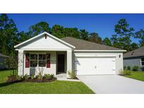 Charming single-Gathering home featuring an attached two-car garage and a well-manicured lawn at 1055 Morfontain St, Daytona Beach, FL 32124