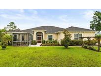 Beautiful single story home with a screened in lanai and well manicured landscaping at 18920 Overton St, Orlando, FL 32833