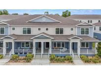 Charming townhomes featuring neutral color schemes and covered front porches for relaxing outdoor living at 452 Diamond Dove Cv, Winter Springs, FL 32708