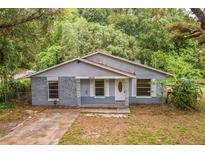 Charming single-story home with a brick accent wall and inviting front porch at 1212 N Hudson St, Orlando, FL 32808