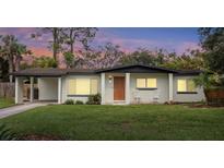 Charming single-story home with a well-maintained lawn, inviting porch, and warm curb appeal at 1945 Bering Ave, Winter Park, FL 32789