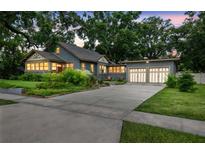 Charming home with well-manicured lawn, mature trees, and a two-car garage at 524 S Lakeview Ave, Winter Garden, FL 34787