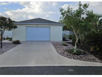Charming single-story home with a one-car garage and meticulous landscaping at 1008 Jackson St, The Villages, FL 32162