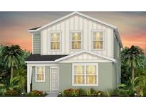 Charming two-story home with eye-catching architectural details and a well-manicured lawn at 5015 Starling Bird Ln, St Cloud, FL 34771
