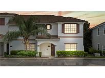 Charming two-story townhome with well-maintained landscaping and a welcoming front entrance at 3193 Pequod Pl, Kissimmee, FL 34746