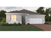 Charming single-story home with a two-car garage and manicured lawn at 2075 Town Pasture Dr, Eustis, FL 32726