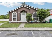 Charming single-story home with a well-manicured lawn and inviting front entrance at 298 San Gabriel St, Winter Springs, FL 32708