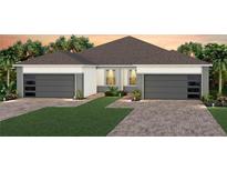 Charming single-story home showcasing a well-manicured lawn and a convenient two-car garage at 13533 Pearl Beach St, Winter Garden, FL 34787