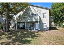 A multi-Gathering home with outdoor seating areas and stairs to the upper units at 5821 La Costa Dr # 108, Orlando, FL 32807