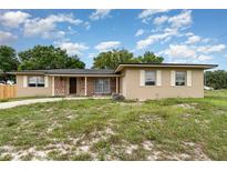 Charming single-story home featuring brick accents and a well-maintained lawn at 2078 Keyes Ln, Deltona, FL 32738