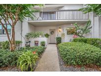 Charming home exterior featuring a quaint front entrance and a lovely balcony above the front door at 240 Killarney Bay Ct # 4, Winter Park, FL 32789