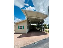 Charming single-story home featuring a convenient covered carport and well maintained exterior at 1115 Deer Creek Blvd, Davenport, FL 33837