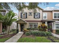 Charming two-story home with a landscaped front yard and inviting entrance, perfect for a Gathering at 12884 Calderdale Ave, Windermere, FL 34786