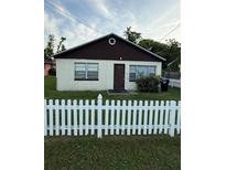 Modest home featuring a white picket fence and neutral color scheme at 1425 26Th St, Orlando, FL 32805