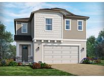 Charming two-story home with a well-manicured lawn and beautiful landscaping at 2272 Hen Rd, Minneola, FL 34715