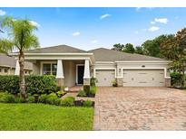 Charming single-story home with a three-car garage and well-manicured landscaping at 31924 Geoff, Sorrento, FL 32776