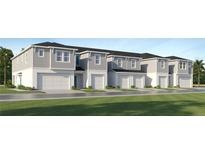 New construction townhomes featuring attached garages and modern exteriors at 349 Sol Vista Dr, Dundee, FL 33838