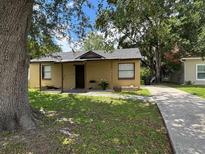 Charming single-story home featuring a quaint front porch and well-maintained lawn at 4035 Nimons St, Orlando, FL 32811
