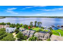 Gorgeous lakefront home with private boat dock and lush green backyard at 5552 Remsen Cay Ln, Windermere, FL 34786