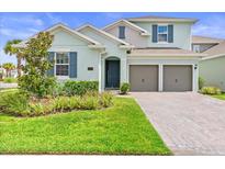 Charming two-story home with manicured lawn and a two-car garage on a sunny day at 19105 Planetree St, Orlando, FL 32827