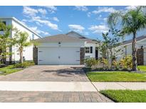 Charming single-Gathering home featuring a two-car garage and well-maintained landscaping at 3110 Areca Ave, New Smyrna Beach, FL 32168
