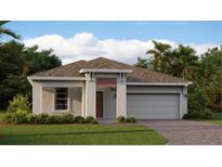 Charming single-story home features a two-car garage, neutral paint, and landscaped front yard with lush green grass at 4674 Coral Harbour Rd, Kissimmee, FL 34758