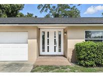 Inviting front entrance featuring a white door with glass panels and brick landing at 161 Peacock, Altamonte Springs, FL 32701