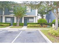 Charming two-story townhome featuring well-maintained landscaping and convenient parking in a desirable community at 3321 Wilshire Way Rd # 6, Orlando, FL 32829