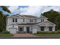 Stunning two-story home featuring a welcoming facade, complemented by a well-manicured lawn and an attached two-car garage at 669 Terrapin Dr, Debary, FL 32713