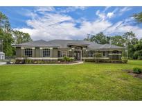 Beautiful single-story home with well-manicured lawn and lush landscaping at 2508 Fawn Run, Oviedo, FL 32765