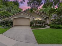 Charming single-story home with well-manicured lawn and mature landscaping, plus a two car garage at 871 Paddington Ter, Lake Mary, FL 32746