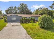 Charming single-story home with well-maintained landscaping and a concrete driveway at 1008 Bay Ave, Lake Wales, FL 33859
