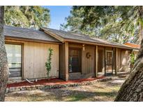 Charming single-story home with mature trees, neutral siding, and well-kept landscaping at 241 Ruth Blvd, Longwood, FL 32750