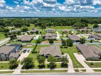 Sprawling community with mature trees, lush lawns, and beautiful single-Gathering homes on a sunny day at 2781 Sand Oak Loop, Apopka, FL 32712