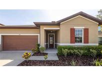 Charming single-Gathering home featuring a well-manicured lawn and inviting front entrance at 922 Suffolk Pl, Davenport, FL 33896