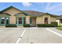 Charming single-story home featuring a well-maintained lawn, manicured shrubs and ample parking at 3280 Villa Way Cir, St Cloud, FL 34769