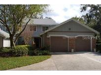 Charming home featuring a two-car garage and a well-maintained lawn and garden area at 641 Maple Oak Cir # 101, Altamonte Springs, FL 32701