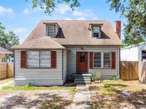 Charming bungalow-style home with dormer windows and a cozy front porch and well-maintained exterior at 25 E Pinecrest Ave, Eustis, FL 32726