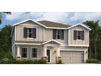 Charming two-story home with welcoming entrance and a two-car garage at 4699 Golden Knight Blvd, Kissimmee, FL 34746