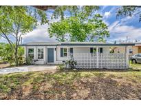 Charming single-story home with a well-maintained front yard and distinctive concrete privacy wall at 7601 Aviano Ave, Orlando, FL 32819