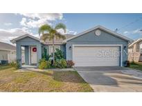 Charming single-story home with a well-maintained lawn and inviting front entrance at 316 Bennett St, Auburndale, FL 33823