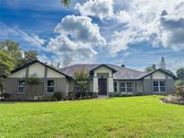 Charming single-story home with a well-manicured lawn and mature landscaping offers great curb appeal at 3417 Bay Meadow Ct, Windermere, FL 34786