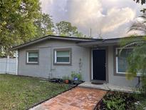 Charming single-story home with brick walkway and neutral exterior paint at 603 Zinnia Dr, Casselberry, FL 32707