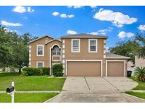 Charming two-story home featuring a three-car garage and well-maintained landscaping at 3322 Park Branch Ave, Clermont, FL 34711