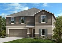 Charming two-story home with gray siding, shutters, a well-manicured lawn, and an attached garage at 3820 Elk Bluff Rd, St Cloud, FL 34772