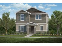 Charming two-story home with craftsman details, gray siding, and well-maintained landscaping at 742 Overpool Ave, Davenport, FL 33896