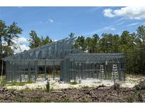 New home construction with steel framework, metal stud walls and high ceilings ready for custom design and finishing touches at 5025 Sw 179Th Pl, Ocala, FL 34473