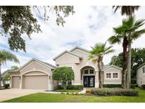 Charming single-Gathering home with lush landscaping, manicured lawn, and a welcoming front entrance at 697 Broadoak Loop, Sanford, FL 32771
